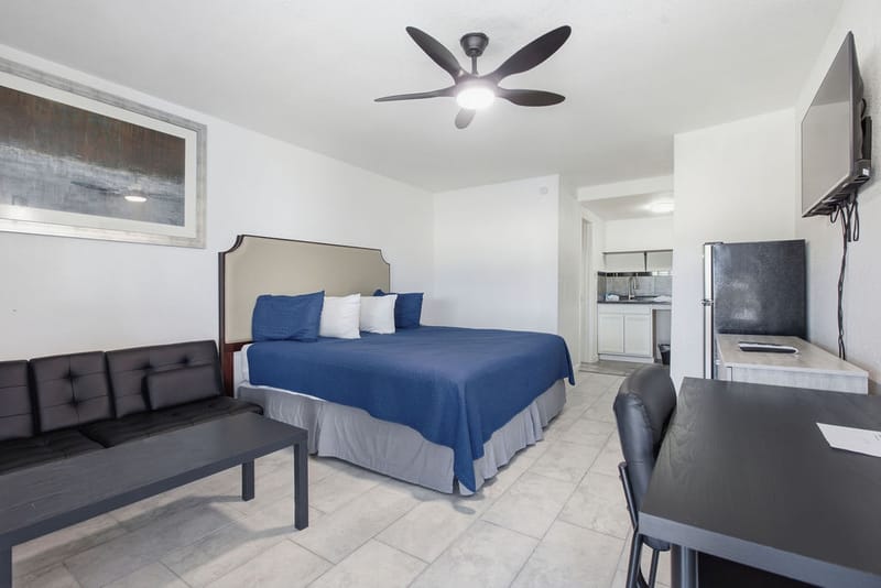 Renovated Premium King Room at R Nite Star Hotel & Lounge with a king bed, ceiling fan, and kitchenette